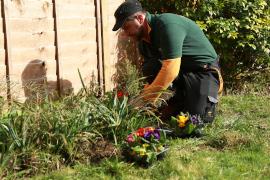 Gardener planting flowers